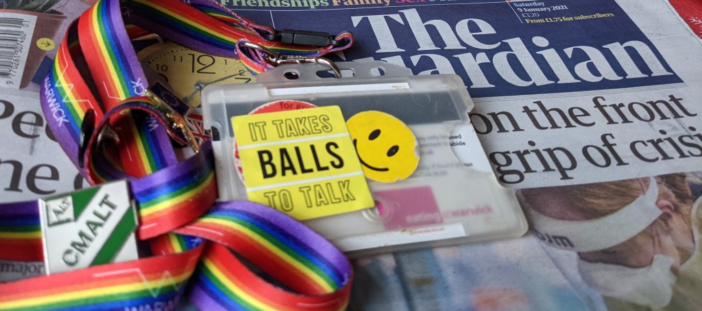 overturned lanyard and today's front page of The Guardian. 